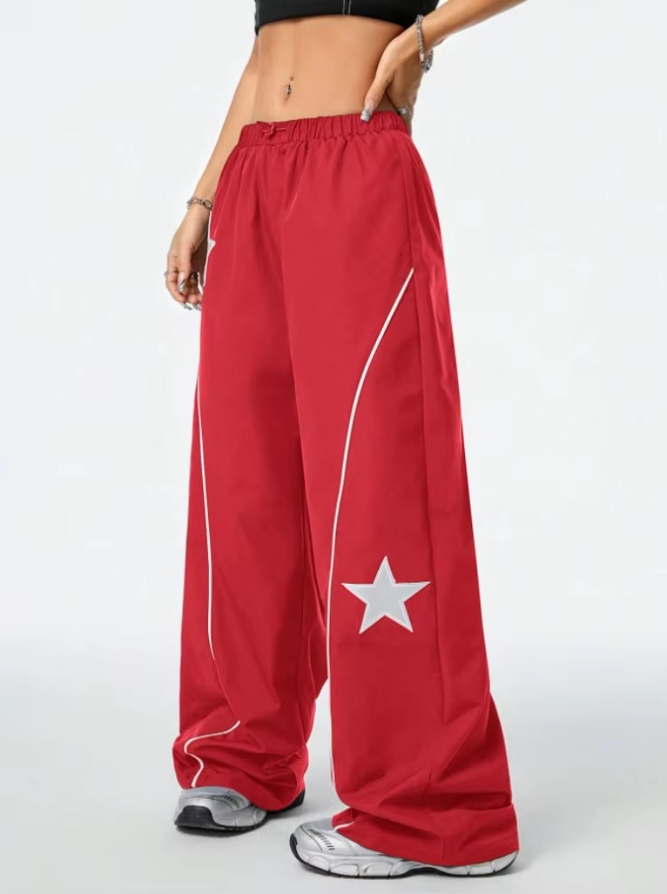Red pants with a white star design on a white background